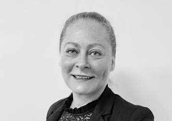CAROLINE SMITH, Chief Commercial Officer