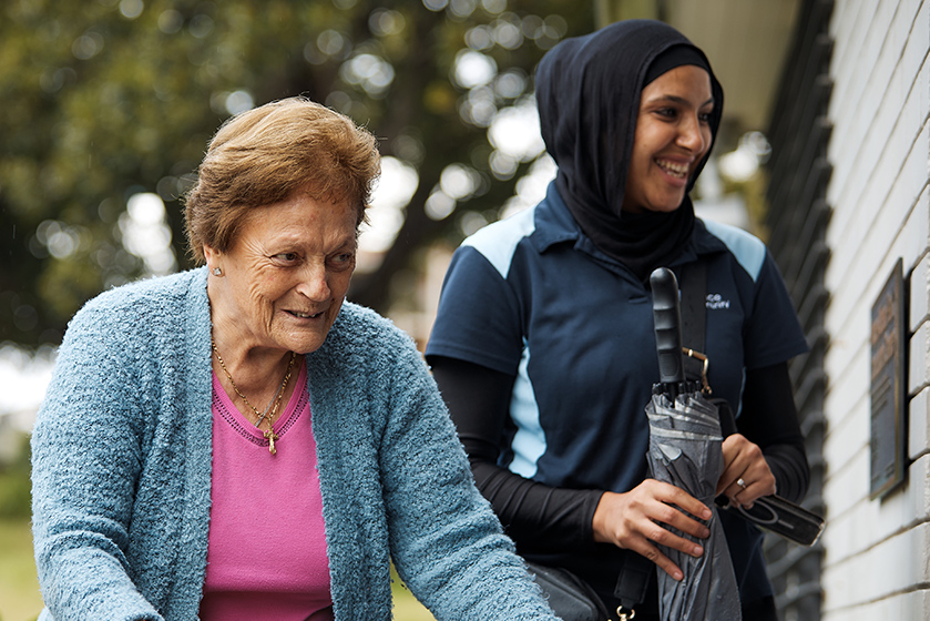Elder lady on a support walker