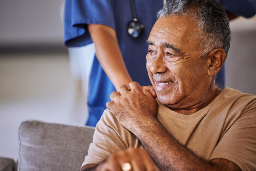Nurse holding the shoulder of patient